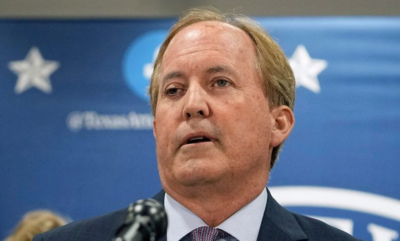 Ken Paxton at the podium
