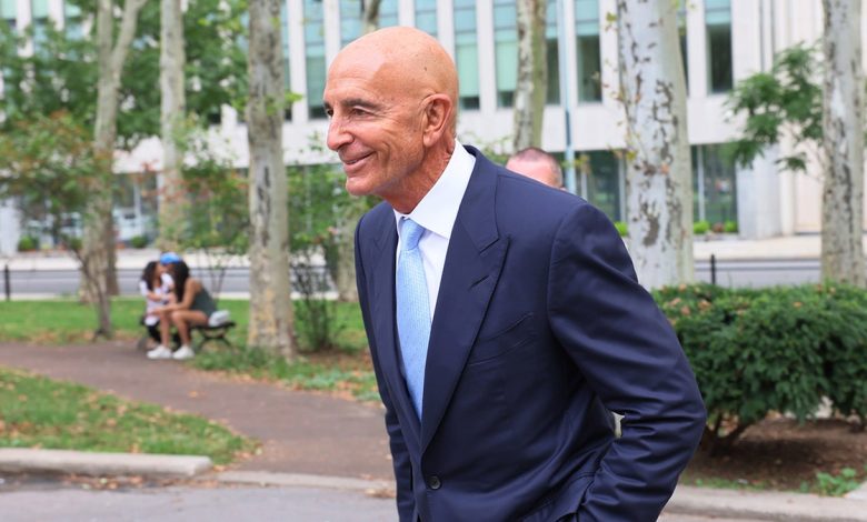 Tom Barrack smiles outside Brooklyn court