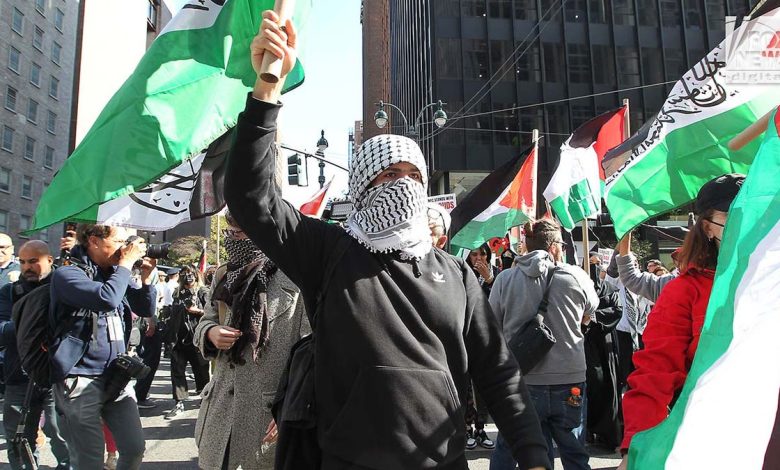 Demonstrators attend an