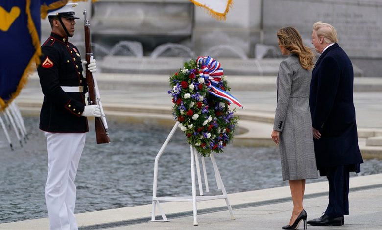 FILE: President Donald Trump and first lady Melania Trump participate in a wreath-laying ceremony at the World War II Memorial in Washington, D.C., to commemorate the 75th anniversary of Victory in Europe Day on May 8, 2020.