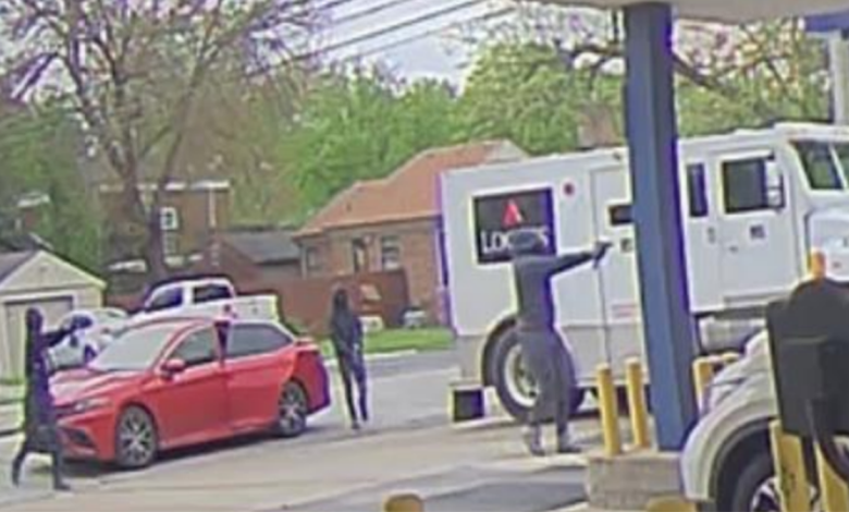 suspects pointing guns at truck