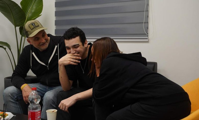 Edan Alexander speaks with loved ones following his release.