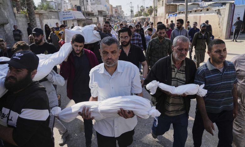 Gaza aid stalled as Israeli strikes kill at least 82 amid famine warnings