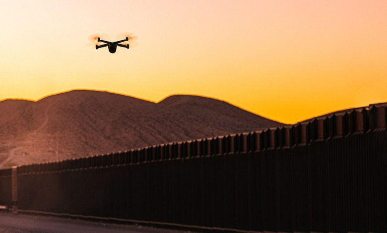 A drone flies over the border