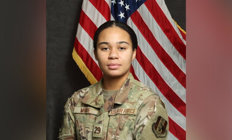 Ava moore in military fatigues posing for official air force headshot