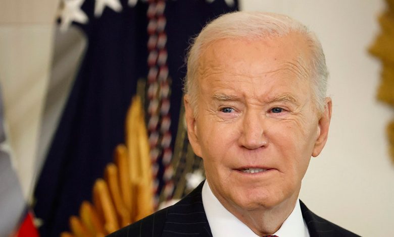 Biden in front of flag