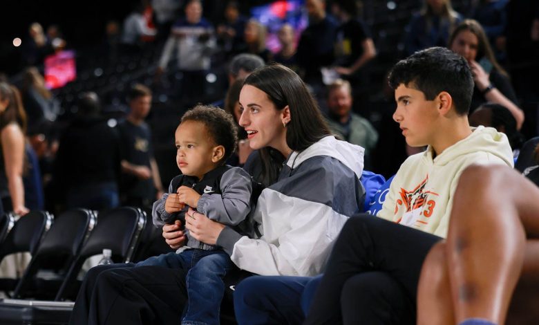 Sidelined WNBA star Caitlin Clark spotted carrying toddler through arena