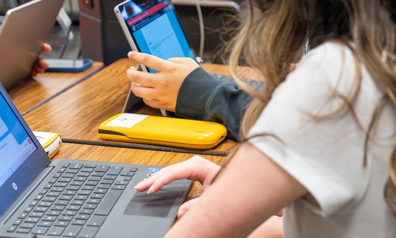 High school students using laptops