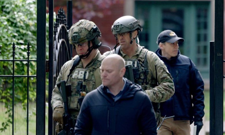 FBI agents leave the Albany Park apartment building