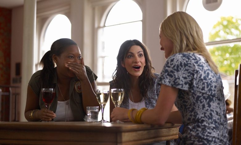 women chat over drinks