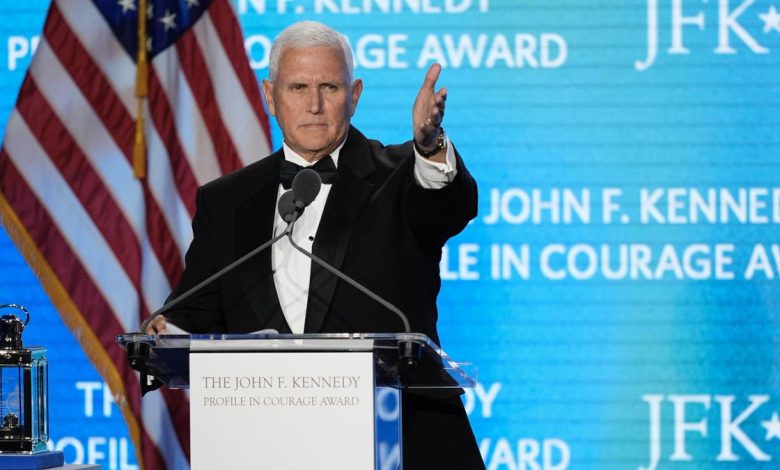 Former Vice President Mike Pence acknowledges his staff members as he speaks after receiving the John F. Kennedy Profile in Courage Award during a ceremony at the JFK Library, Sunday, May 4, 2025, in Boston.