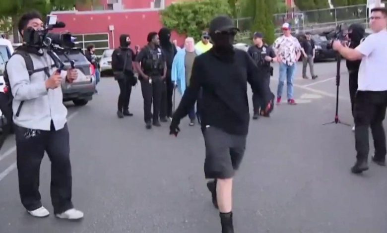 Masked agitators harass Turning Point USA event attendees