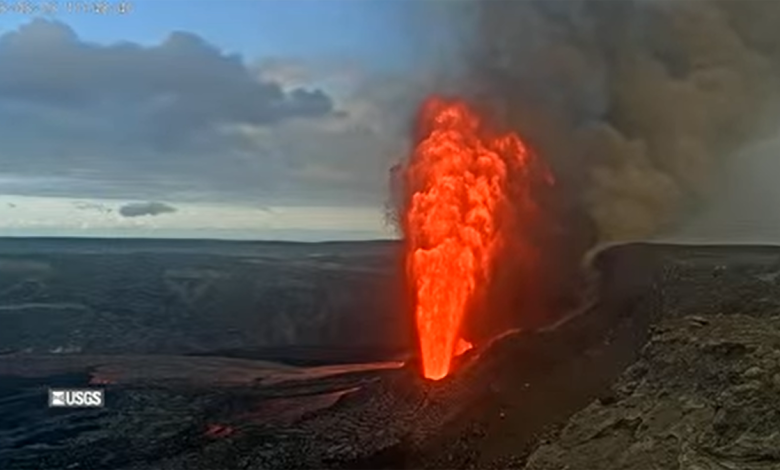 Geiser of orange lava after sunrise
