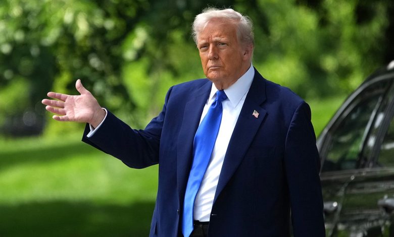 President Donald Trump waves
