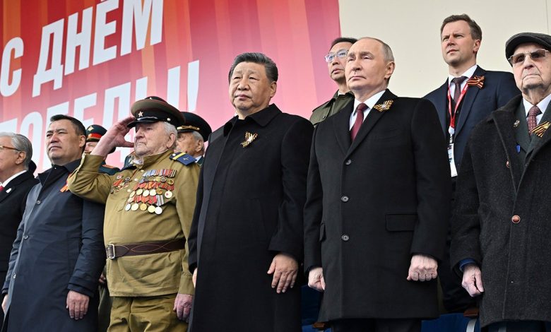China's Xi stands next to Putin at Russia's Victory Day parade