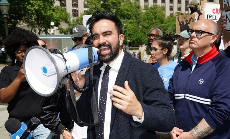 Zohran Mamdani speaking into a megaphone