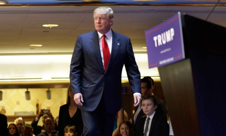 Developer Donald Trump takes the stage to announce that he will seek the Republican nomination for president, Tuesday, June 16, 2015, in the lobby of Trump Tower in New York, Tuesday, June 16, 2015. (AP Photo/Richard Drew)
