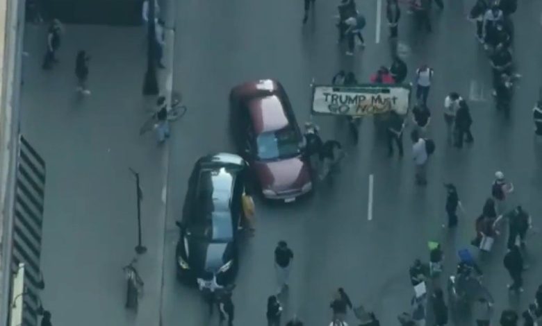 Car plowing through protesters