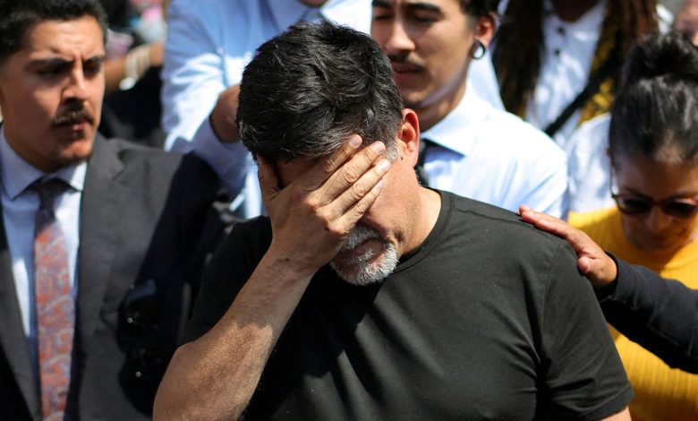 David Huerta with face in hand