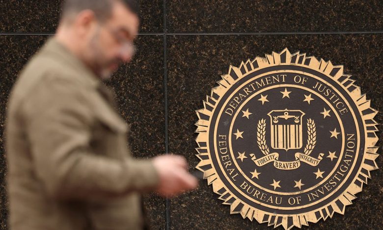 A man walks past a DOJ building