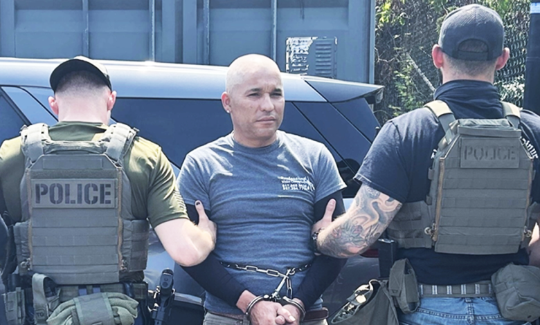 Emelio Neftaly Pineda handcuffed and being escorted by two ICE agents