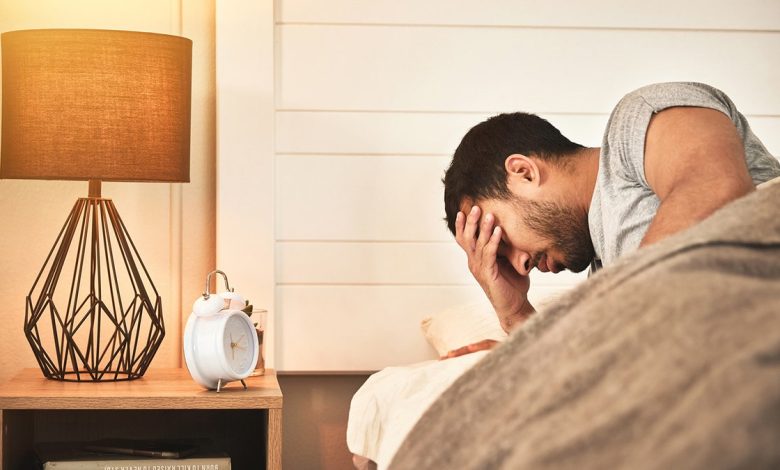 man struggling to sleep