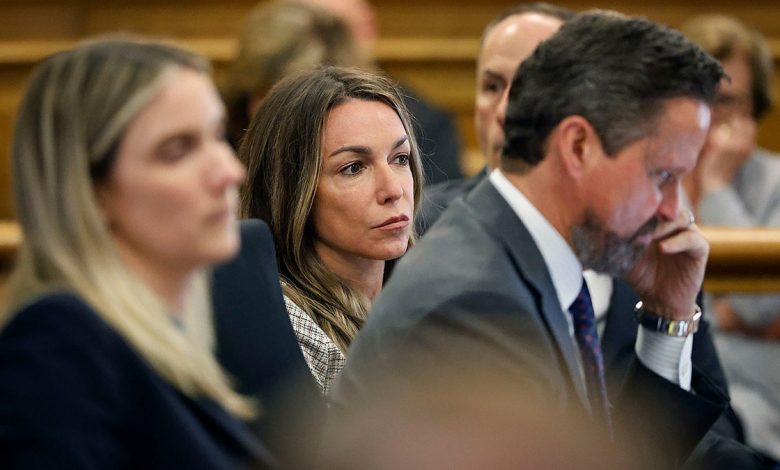 Karen Read in sits with her lawyers in court during her retrial for the murder of John O'Keefe
