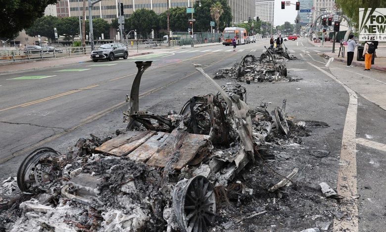 burnt-out car on street in LA