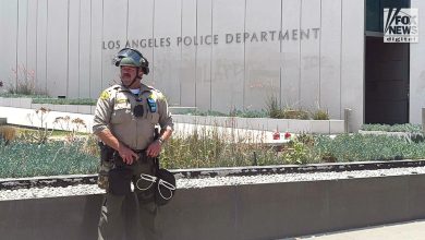 Los Angeles County Sheriff’s deputy stands guard outside LAPD headquarters amid civil unrest