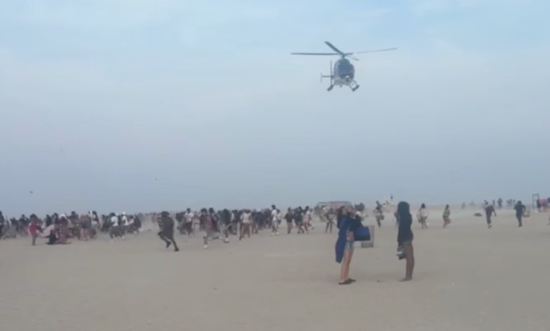 Hundreds of teenagers on Jones Beach