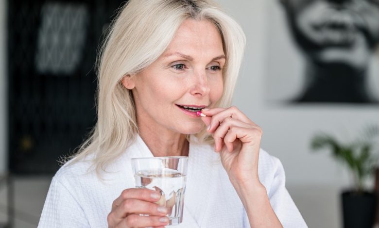 Woman taking pill