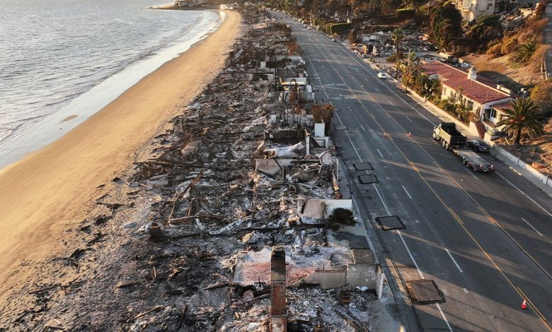 Beachside homes destroyed in the Palisades Fire are seen along the Pacific Coast Highway