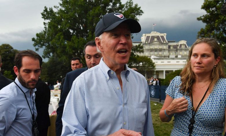 Joe Biden talks to reporters at White House Congressional Picnic.
