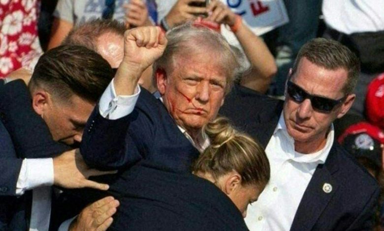 Trump holds fist