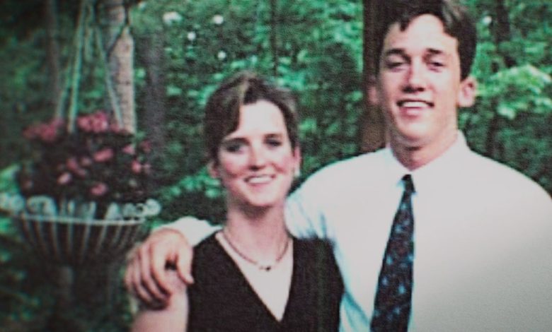 Amy Bradley wearing a black strappy dress being embraced by her brother.