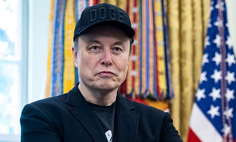 Elon Musk wearing "DOGE" hat