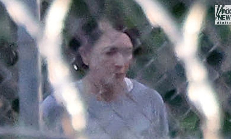 Ghislaine Maxwell is seen behind razor wire in prison