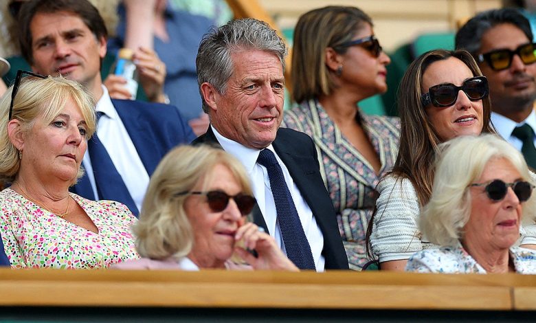 Hugh Grant seemingly takes a nap behind Queen Camilla during Wimbledon