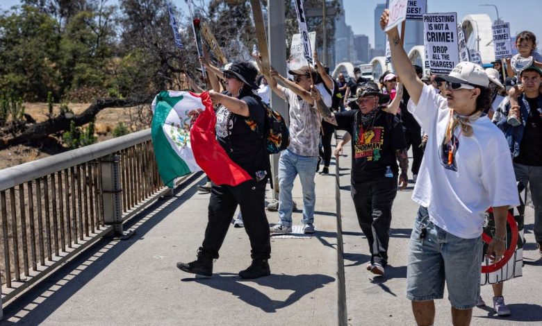 Several dozen protesters stage a demonstration on the Sixth Street Bridge between downtown Los Angeles and Boyle Heights protesting ICE deportations.