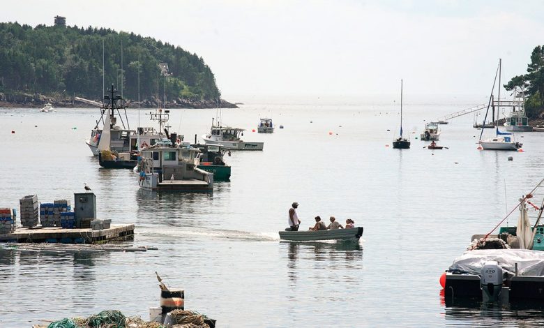 People cross Mackerel Cove on Bailey Island
