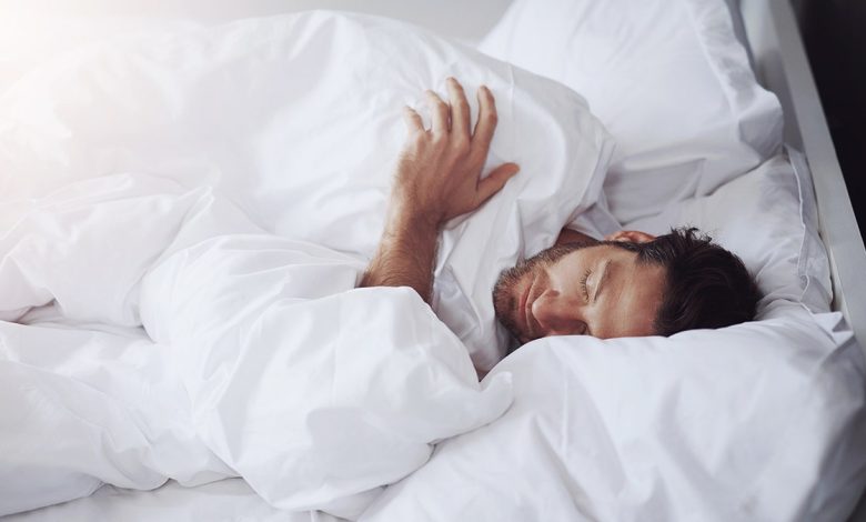 Man asleep in bed