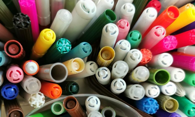 Colorful permanent marker caps view from top