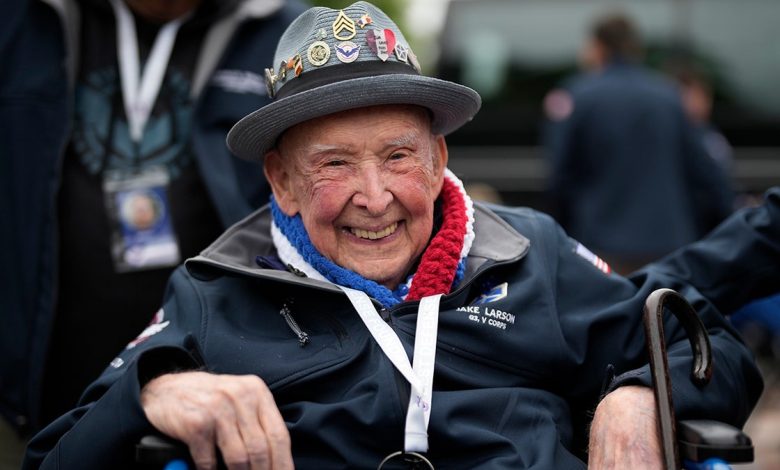 Larson smiles in France on the 79th anniversary of D-Day in 2023