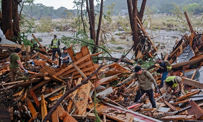 People searching through Texas flood debris