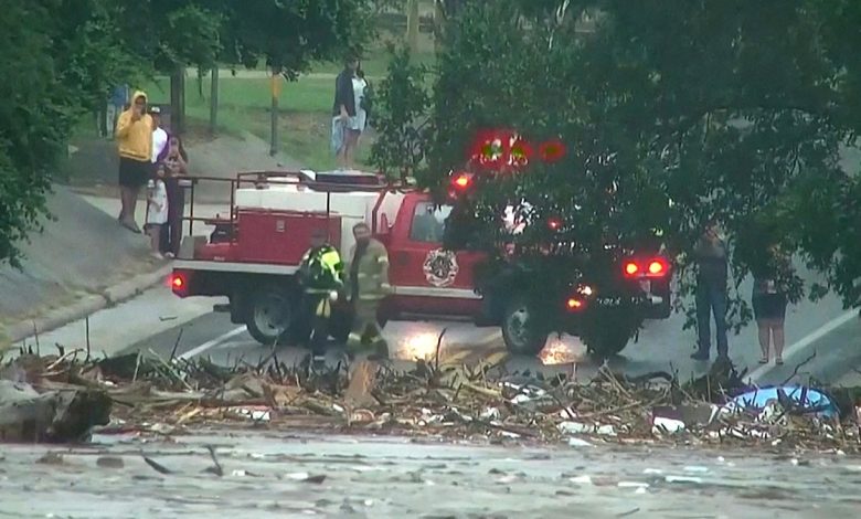 First responders survey rising flood waters of the Guadalupe River after flash flooding in Kerr County