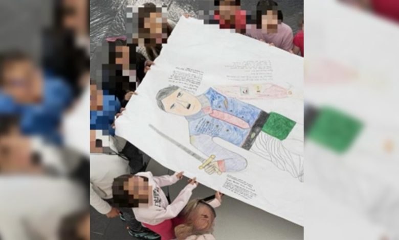 Hitler cartoon held by students at Nysmith School for the Gifted