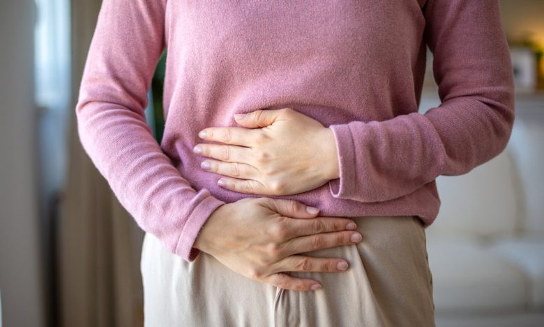 Woman holding gut