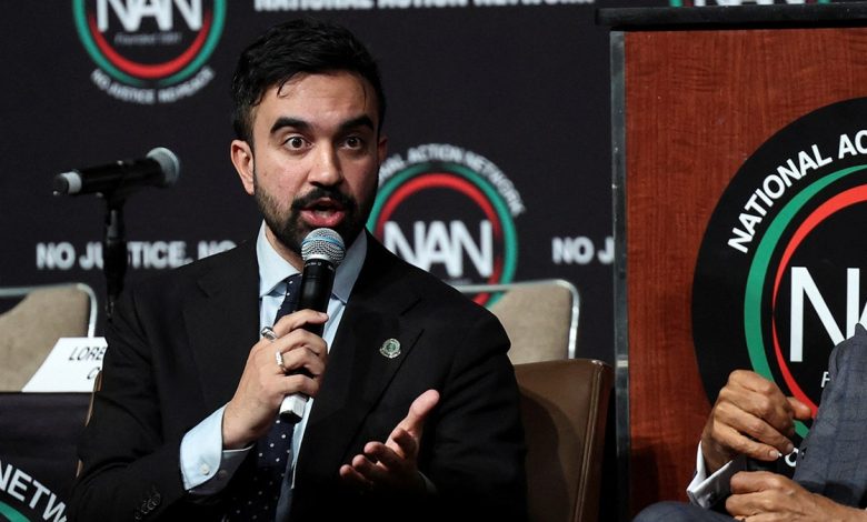 Zohran Mamdani speaking into a microphone